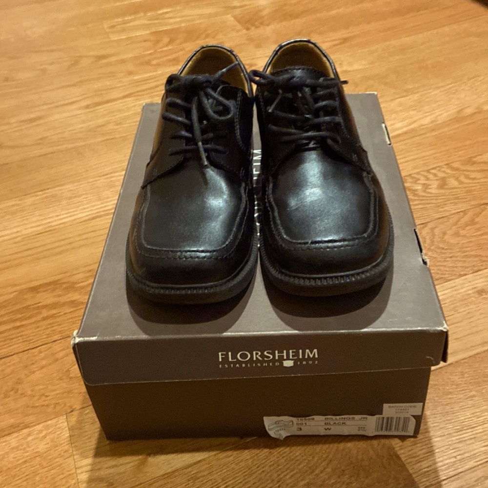Boys Florsheim black stylish dress shoes.  Comfortable, rubber sole.